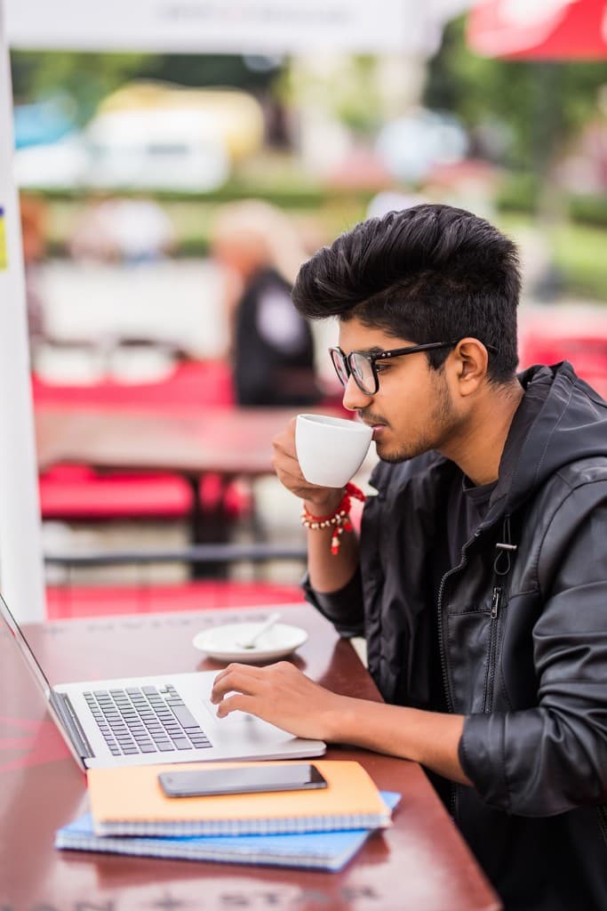B.Com student learning with a laptop in a professional setting