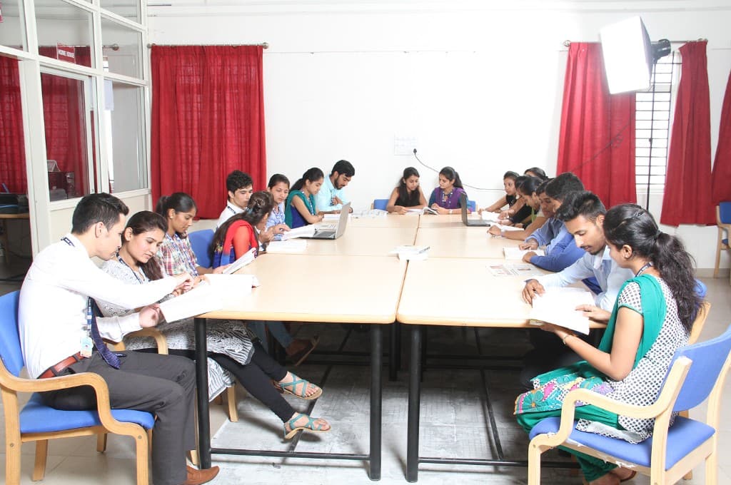 Students studying together in the BIHE library reading hall